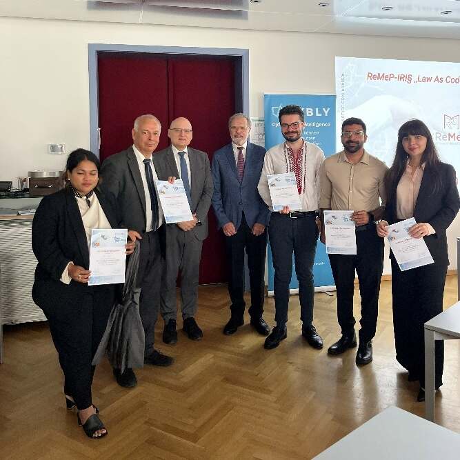 Group photo of the participants holding their certificates at the final ceremony